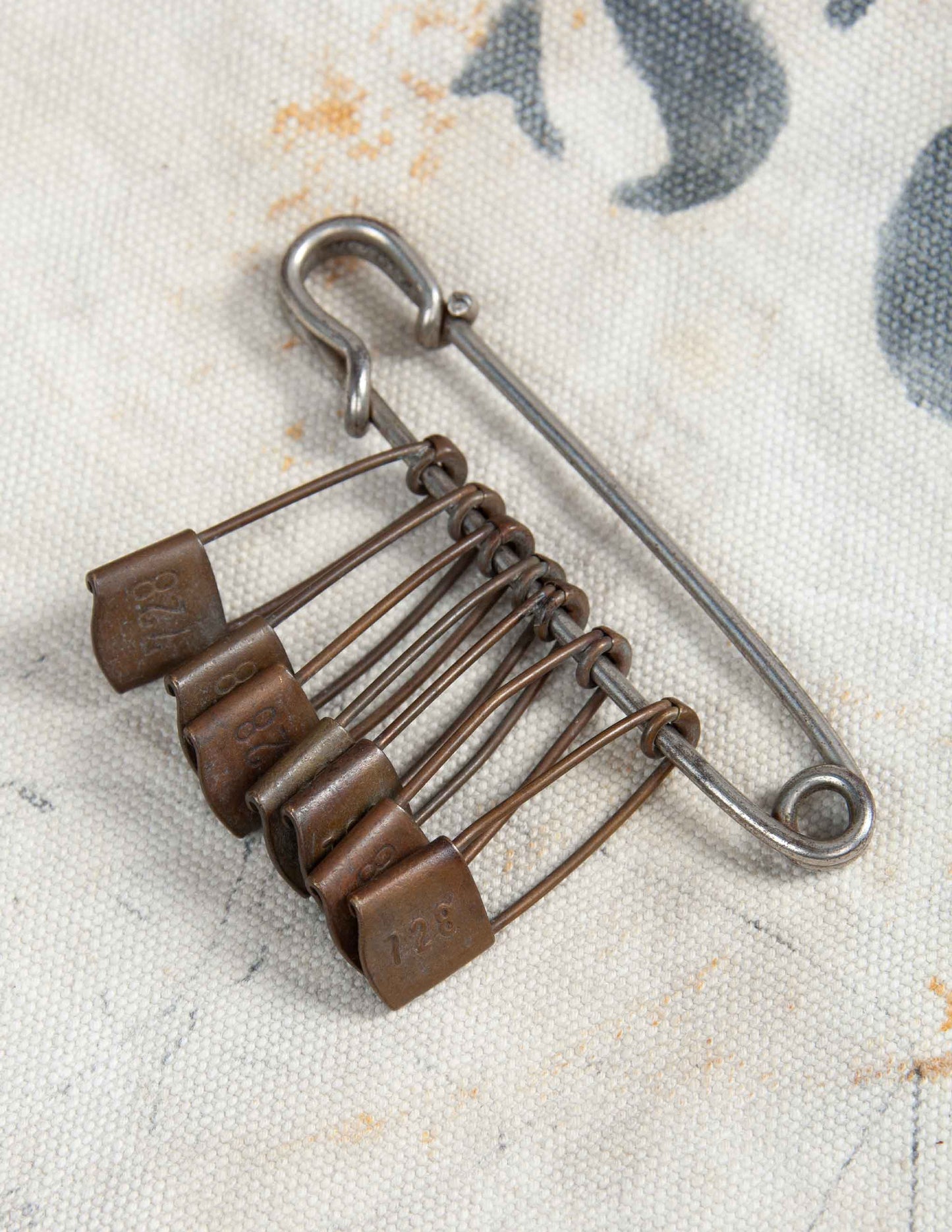 Vintage Safety Pin with Seven Numbered Gear Pins